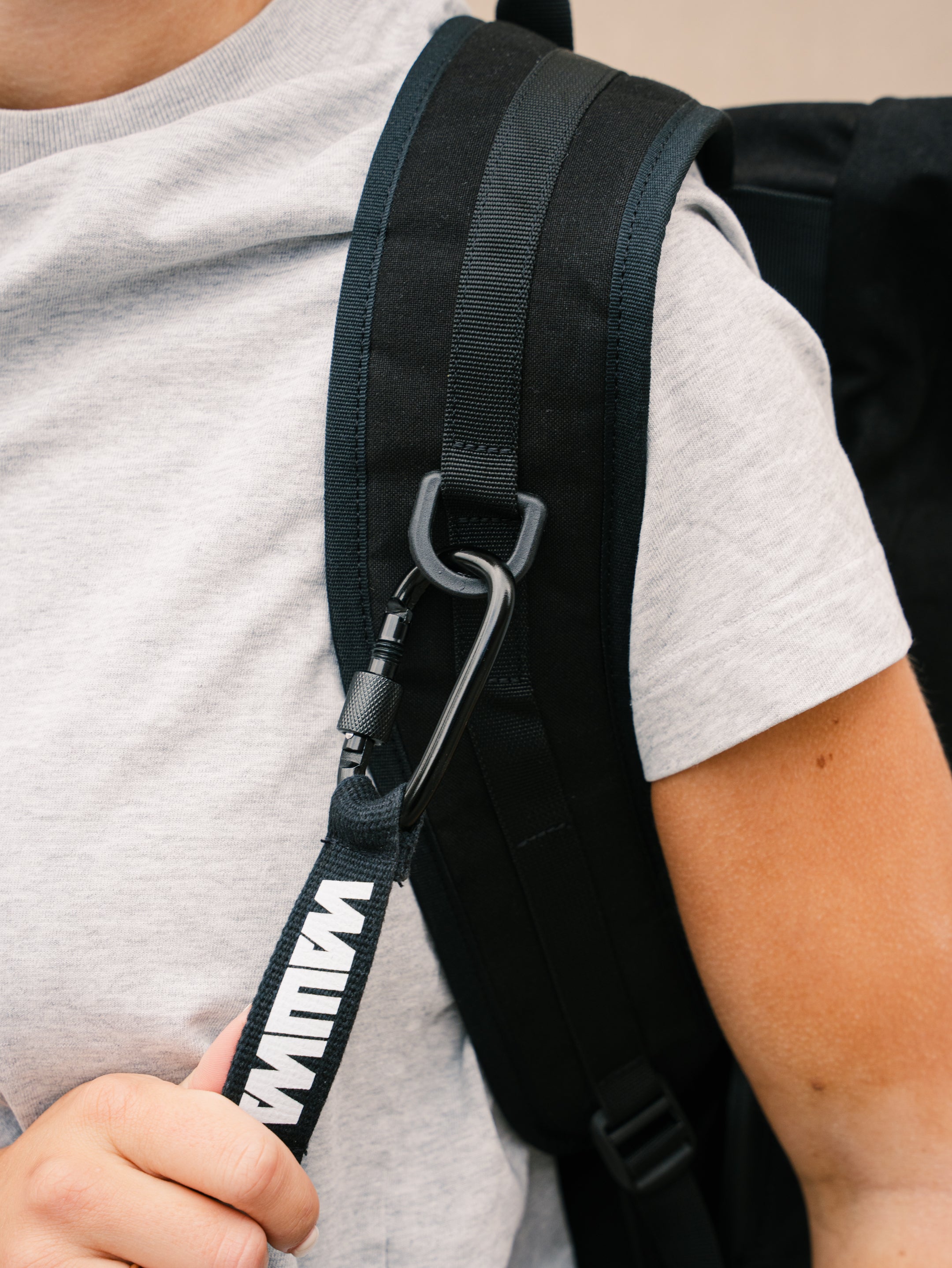 Carabiner key strap detail on the Bridge Backpack in Black