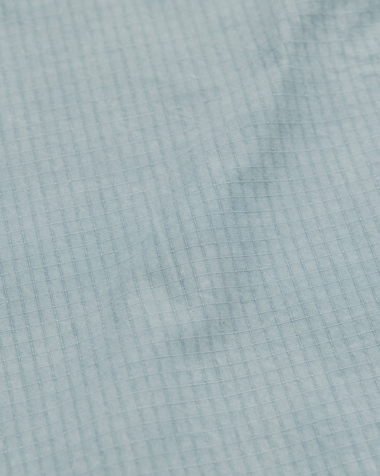 Garment Dyed Atlas Pants - Powder Blue — ripstop fabric texture close-up