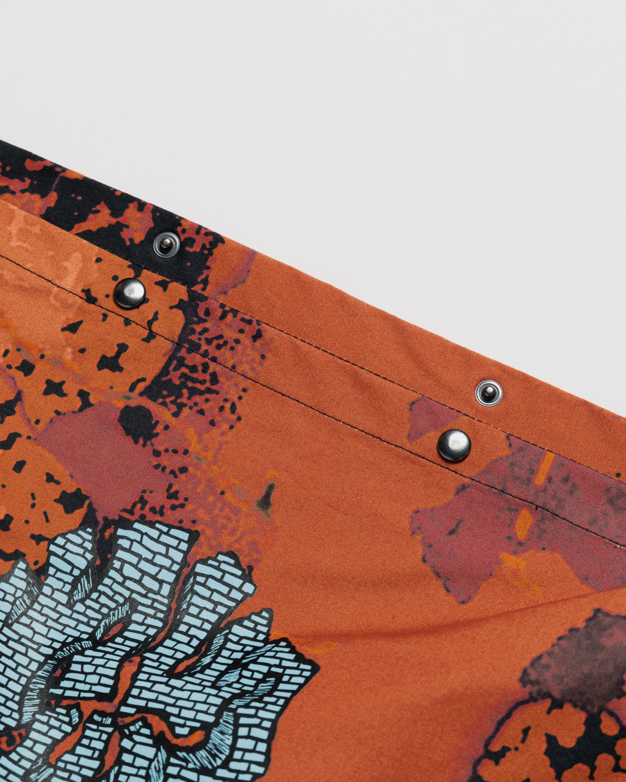 Musette - Abstract Brick Camo — snap studs detail