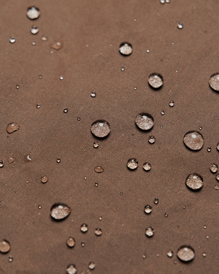 Roam Raglan Jacket - Bracken — water beading proves weatherproofing