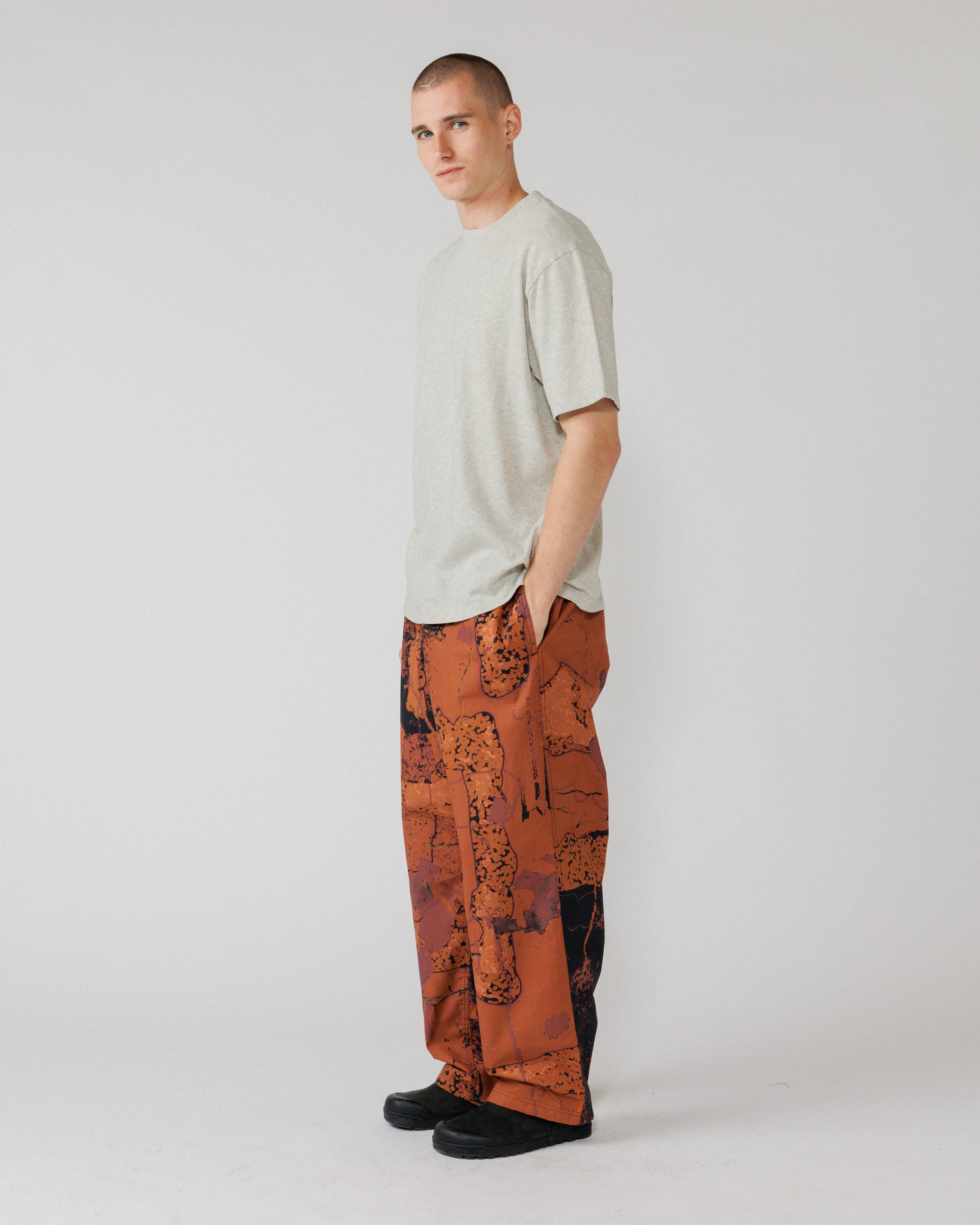 Water Resistant Zama Pants - Abstract Brick Camo — 3/4 angle, drape and pocket